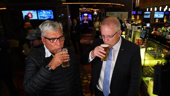 Prime Minister Scott Morrison and Liberal candidate for Gilmore Warren Mundine at the Bomaderry Bowling Club on the NSW South Coast on Friday. Picture: AAP