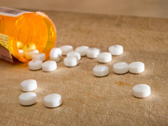 White pills spilled out over some wood  Picture: istock