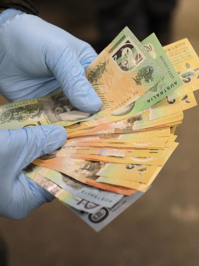 Officers discovered cash in their raids on the Goulburn homes.