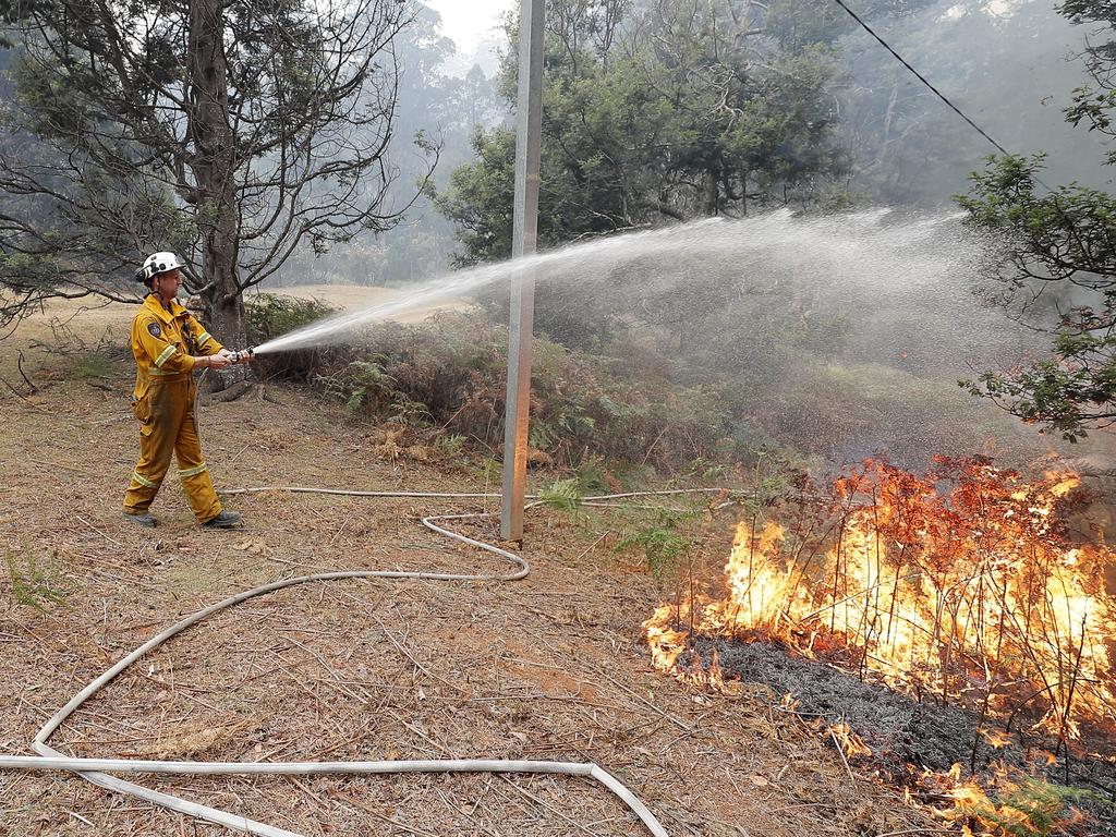 Conducting a back-burn at the top of Donnellys Rd, Geeveston, to protect a house. Picture: RICHARD JUPE