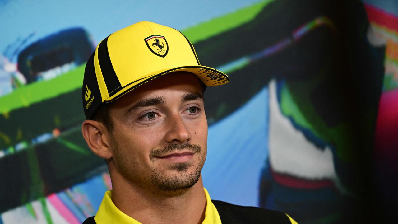 Ferrari's Monegasque driver Charles Leclerc smiles during a press conference at the Autodromo Nazionale circuit in Monza on September 8, 2022 ahead of the Italian Formula One Grand Prix. (Photo by MIGUEL MEDINA / AFP)