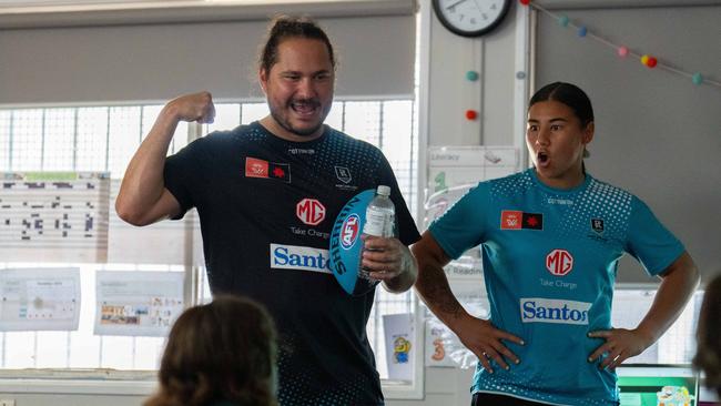 Head of Community Programs, Braedon Talbot alongside AFLW player Hannah Ewings from the Port Adelaide Football Club. Credit: Michael Sullivan.