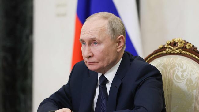 In this pool photograph distributed by the Russian state agency Sputnik, Russia's President Vladimir Putin chairs a meeting with members of the government via videoconference. Picture: AFP