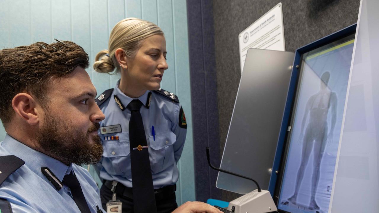 Manager, Security Adelaide Women’s Prison Samuel Forster with General Manager Stephanie Flint looking at the new body scanner. Picture: Kelly Barnes