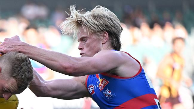 LAUNCESTON, AUSTRALIA - FEBRUARY 27: James Worpel   of the Hawks is tackled by Sam Davidson of the Bulldogs during the 2025 AAMI AFL Community Series match between the Western Bulldogs and the Hawthorn Hawks at University of Tasmania Stadium on February 27, 2025 in Launceston, Australia.  (Photo by Steve Bell/Getty Images)