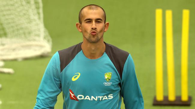 Spinner Ashton Agar trains indoors with the Australian team at Allan Border Field in Brisbane on Saturday.