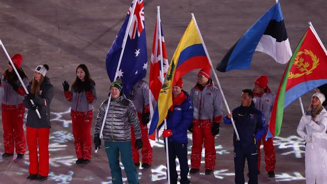 Flagbearer Jarryd Hughes during last night’s closing ceremony. Picture: Getty Images.