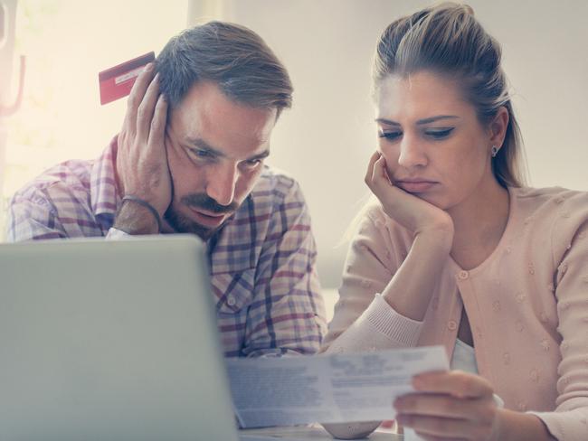 A couple having problem with bills and money. Generic relationships, laptop, expenses. Picture: iStock.
