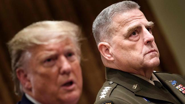 Chairman of the Joint Chiefs of Staff Army General Mark Milley listens while US President Donald Trump speaks before a meeting with senior military leaders in the Cabinet Room of the White House in Washington.