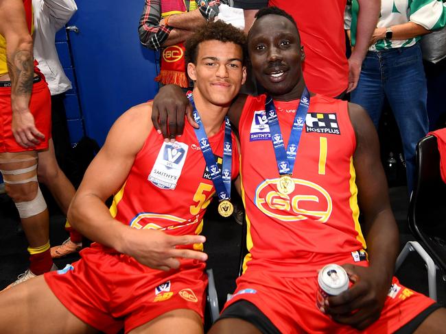 Leonardo Lombard and Mabior Chol of the Suns celebrate following the 2023 VFL premiership. Picture: Morgan Hancock/AFL Photos.