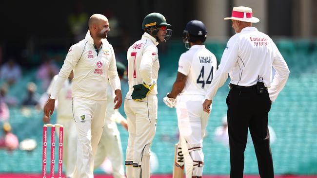 Tim Paine and Nathan Lyon question umpire Paul Wilson. Picture: Getty Images