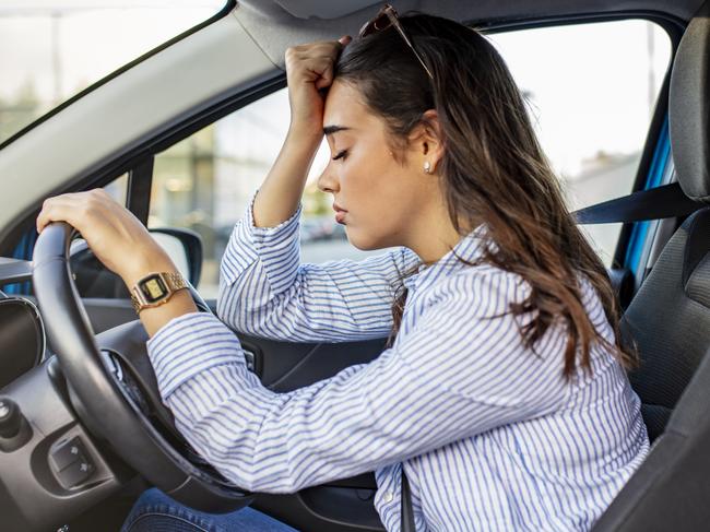 Stressed woman drive car feeling sad and angry. Girl tired, fatigue mental on car. Sleepy and drunk female hangover. Illegal law driver license. Driving when tired and do not drive drowsy concept