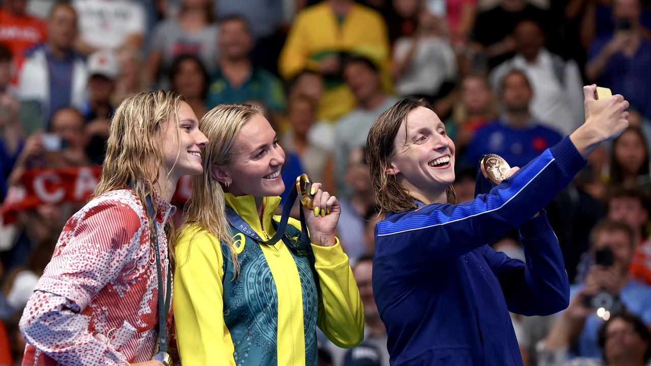 NANTERRE, FRANCE - JULY 27: Silver Medalist, Summer McIntosh of Team Canada, Gold Medalist, Ariarne Titmus of Team Australia and Bronze Medalist, Katie Ledecky of Team United States pose for a selfie with their medals during the Medal Ceremony after the Women's 400m Freestyle Final on day one of the Olympic Games Paris 2024 at Paris La Defense Arena on July 27, 2024 in Nanterre, France. (Photo by Maddie Meyer/Getty Images)