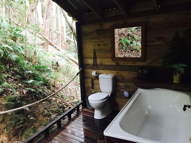 The treehouse’s bathroom, complete with tub and flushing toilet.