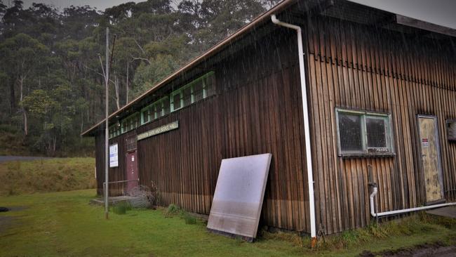 Huon Valley locals assess the damages in the aftermath of Sunday's floods. Picture: Kenji Sato