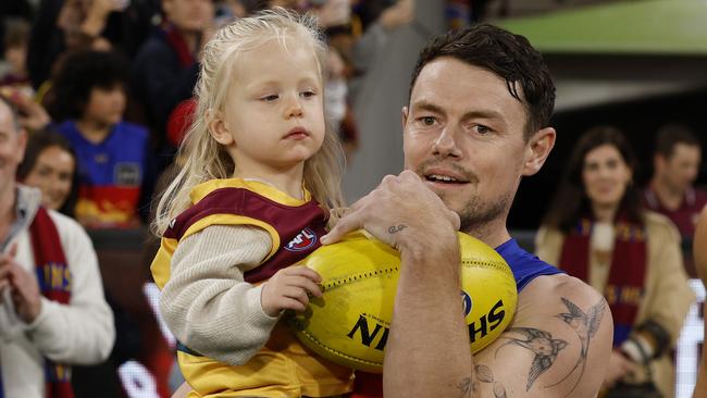 MELBOURNE , AUSTRALIA. April 11, 2024.  AFL . Round 5 . Melbourne vs Brisbane at the MCG.   Lachie Neale of the Lions  comes out for game 250 with his daughter   . Pic: Michael Klein