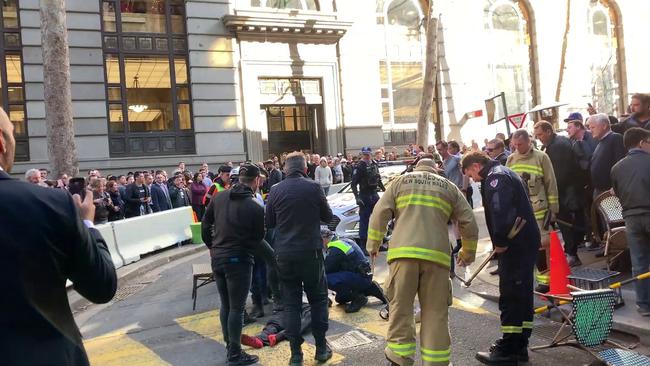 Ney is detained by bystanders. Picture: Marc Kean