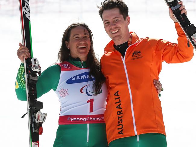 PYEONGCHANG-GUN, SOUTH KOREA - MARCH 14:  Bronze Medalists Melissa Perrine of Australia and her guide Christian Geiger celebrates at the victory ceremony for Women's Giant Slalom Run 2 - Visually Impaired at Alpensia Biathlon Centre on day five of the PyeongChang 2018 Paralympic Games on March 14, 2018 in Pyeongchang-gun, South Korea.  (Photo by Lintao Zhang/Getty Images)