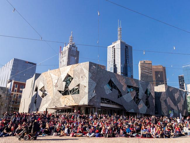 MELBOURNE, AUSTRALIA - SEPTEMBER 22:  Fans at Federation Square in Melbourne Watch the AFL Preliminary Final Between the West Coast Eagles and the Melbourne Demons at Federation Square on September 22, 2018 in Melbourne, Australia.  (Photo by Daniel Pockett/Getty Images)