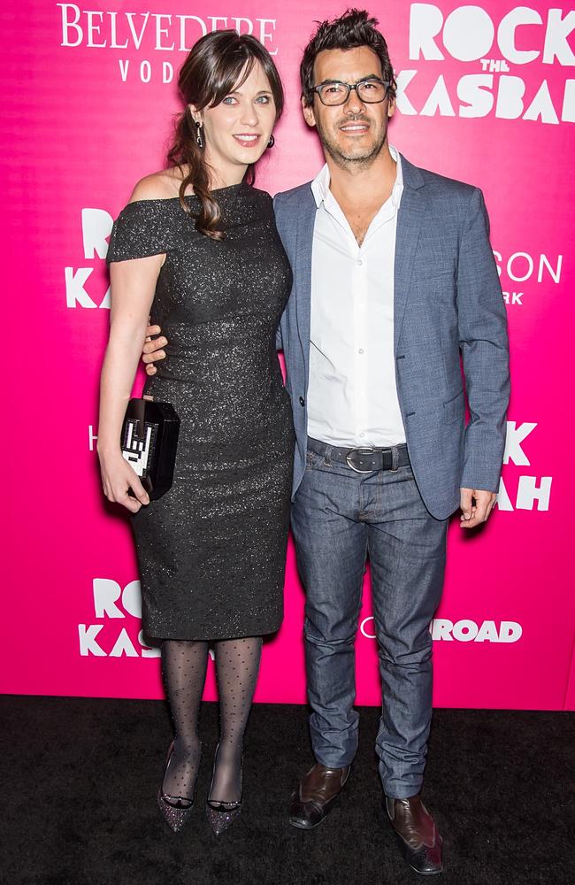 Post baby body ... Actress Zooey Deschanel and husband film producer Jacob Pechenik at the 'Rock The Kasbah' New York Premiere. Picture: Getty