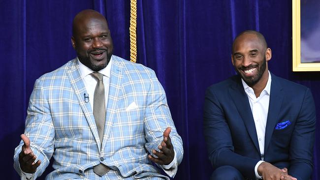 Los Angeles Lakers player Shaquille O'Neal with Kobe Bryant. Photo by KEVORK DJANSEZIAN / GETTY IMAGES.