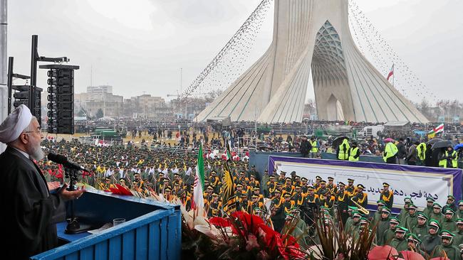 President Hassan Rouhani addresses crowds during a ceremony celebrating the 40th anniversary of Islamic Revolution.