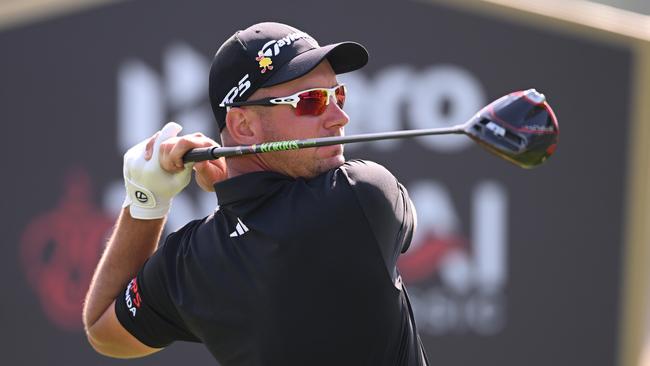 DUBAI, UNITED ARAB EMIRATES - JANUARY 30: Lucas Herbert of Australia tees off on the 18th hole during the Final Round on Day Five of the Hero Dubai Desert Classic at Emirates Golf Club on January 30, 2023 in Dubai, United Arab Emirates. (Photo by Ross Kinnaird/Getty Images)