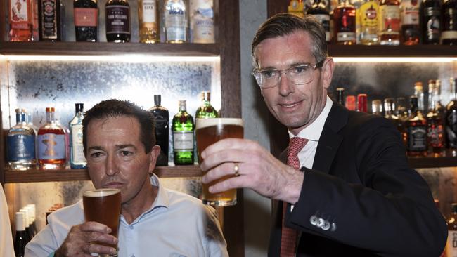 NSW Premier Dominic Perrottet and Deputy Premier Paul Toole drink a beer at Watson’s Pub in Moore Park