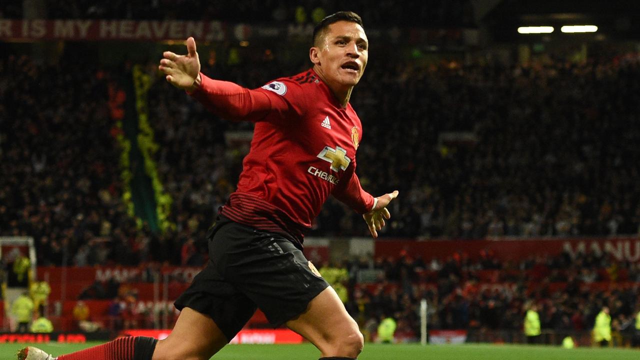 Sanchez celebrates his goal against Newcastle. (Photo by Oli SCARFF / AFP) /   /