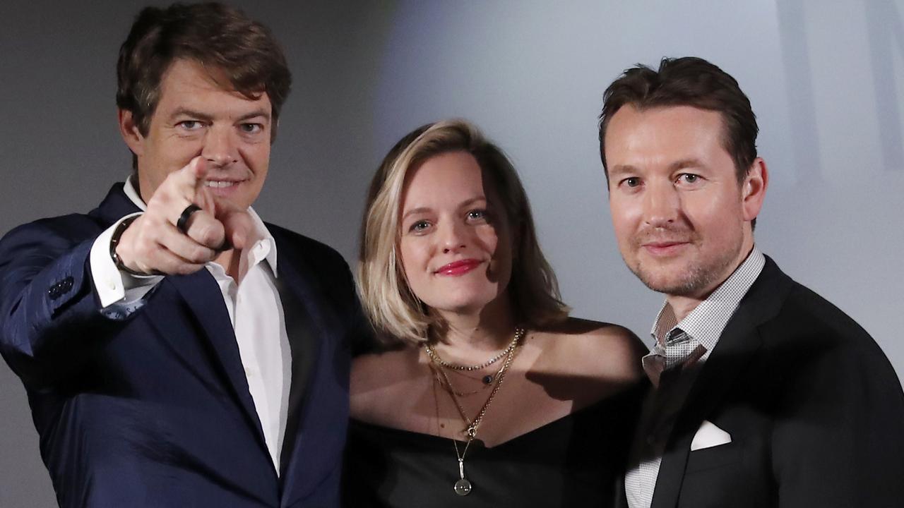 Producer Jason Blum, actor Elisabeth Moss with Whannell at the Paris premiere of The Invisible Man (AP Photo/Francois Mori)