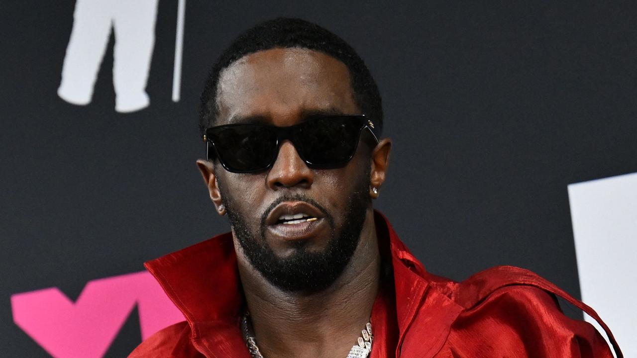 US producer-musician Sean 'Diddy' Combs poses with the Global Icon award. Photo: ANGELA WEISS / AFP.