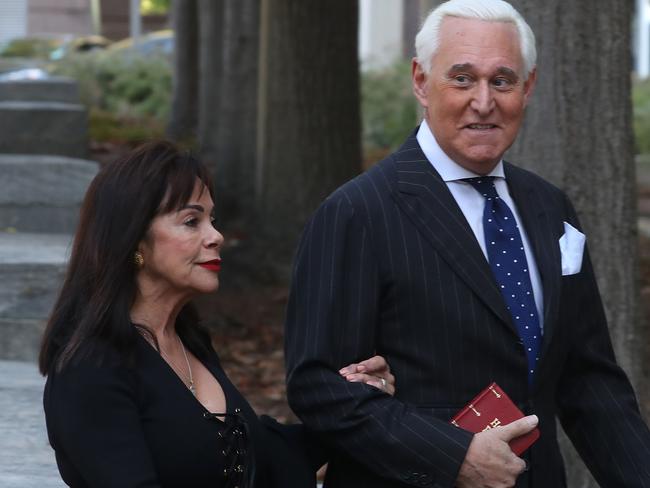 Roger Stone, former Adviser to President Donald Trump, clutches a bible as he arrive at court with his wife Nydia Stone. Picture: Getty