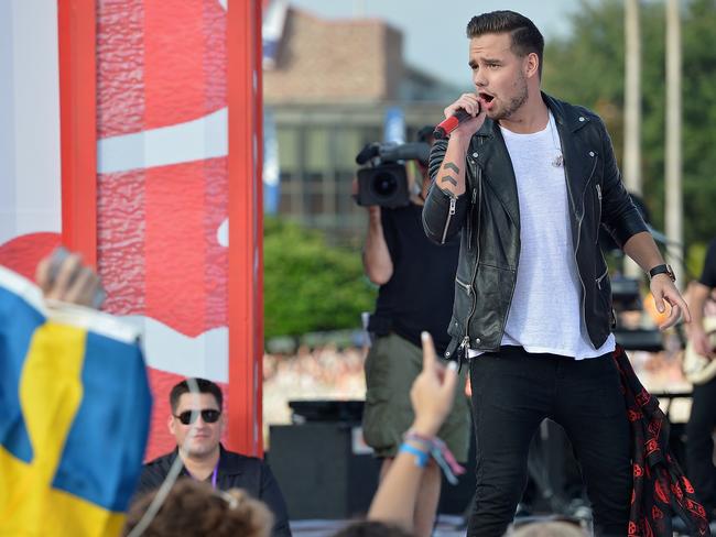 Show goes on...Liam Payne performs in Florida, where the band launched their new album without bandmate Zayn Malik, who was taken ill with a “tummy bug”.