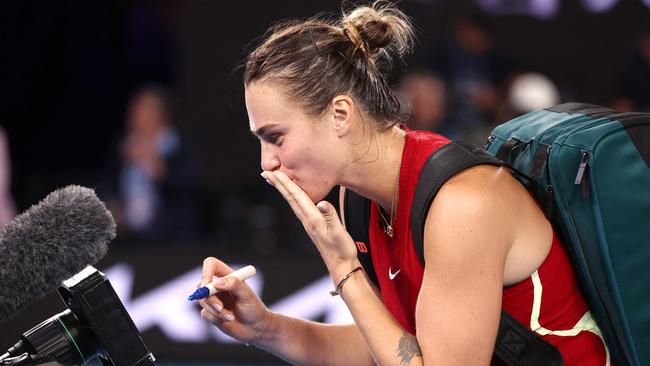 Belarus' Aryna Sabalenka writes a message on TV camera after a victory against USA's Coco Gauff. PictureL David Gray / AFP.