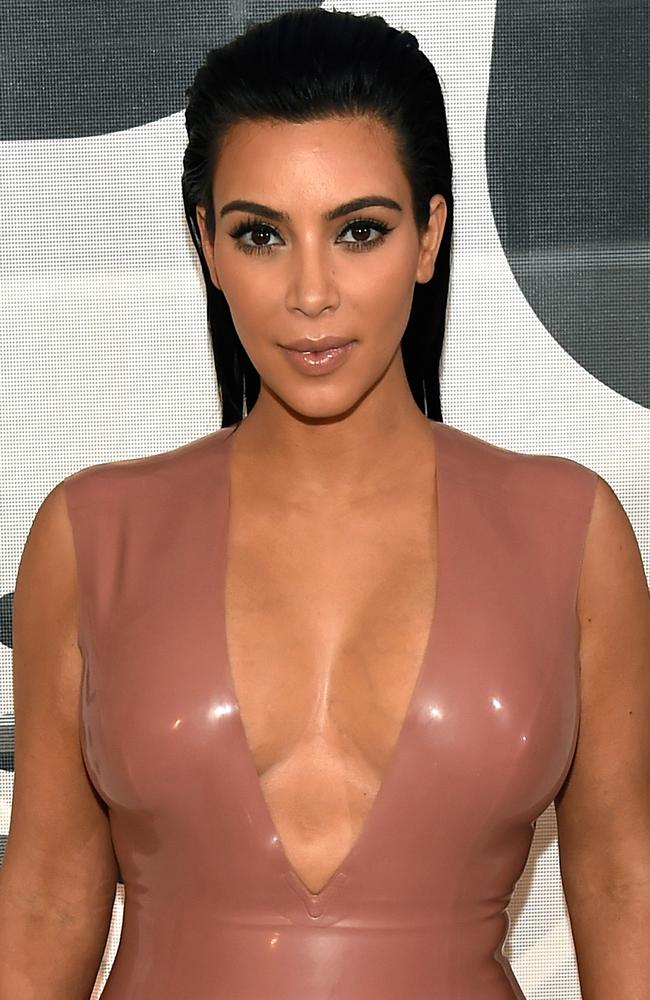 Signature style ... Kim Kardashian is usually done up with thick mascara, contouring on her cheeks and lip gloss. Picture: Getty Images