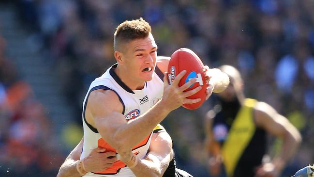 Adam Tomlinson of the Giants under pressure from during the 2019 AFL Grand Final match between the Richmond Tigers and the GWS Giants at the MCG on September 28, 2019 in Melbourne, Australia. Picture: Mark Stewart