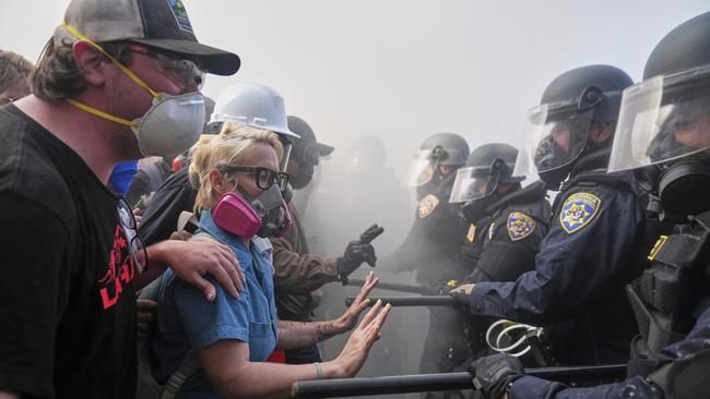 Protesters confront police on the 101 Freeway near the Metropolitan Detention Centre. AP Photo/Jae C. Hong