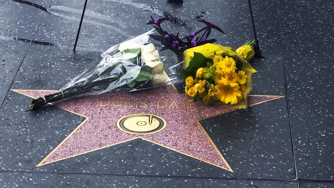 Flowers adorn the star of Doris Day on the Hollywood Walk of Fame in Los Angeles. Picture: AP