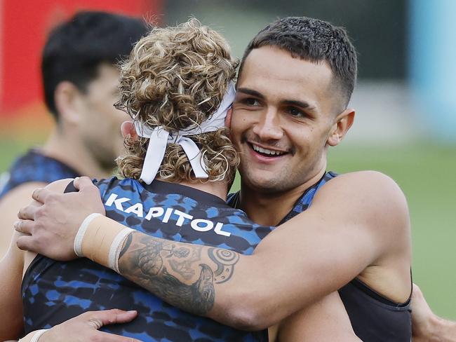 NCA. MELBOURNE, AUSTRALIA. 19th February, 2025 . Western Bulldogs training at the Whitten Oval.   Bulldog Jamarra Ugle-Hagan hugs  Aaron Naughton at training today   .  Picture: Michael Klein