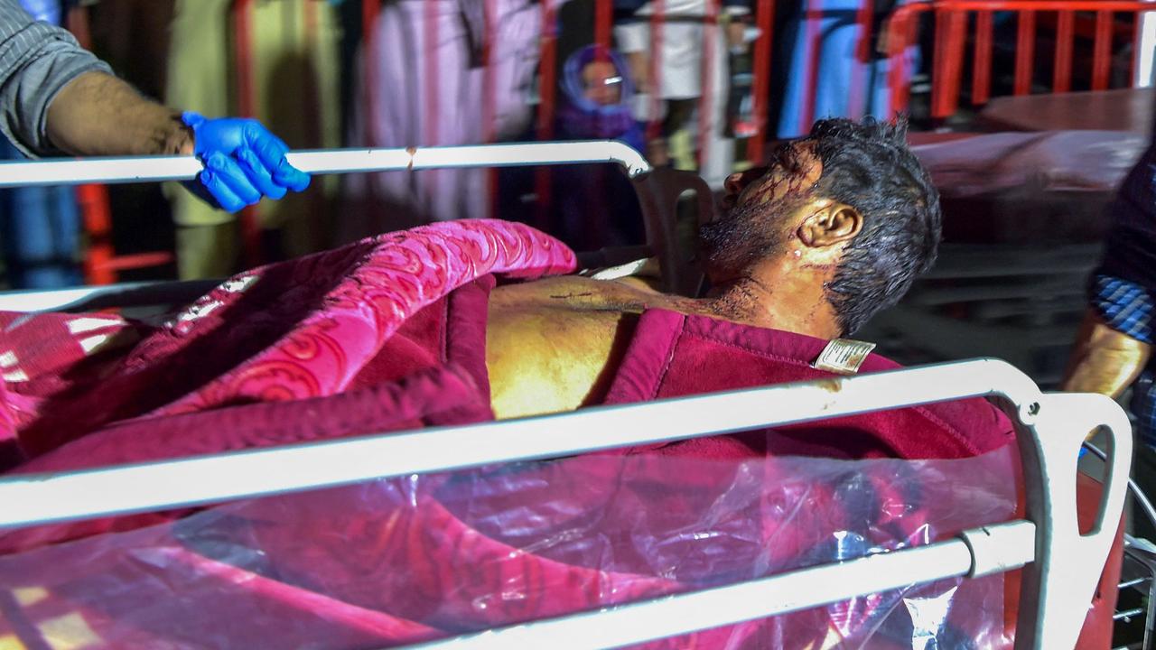 Hospital staff bring an injured man on a stretcher in for treatment. Picture: Wakil Kohsar/AFP