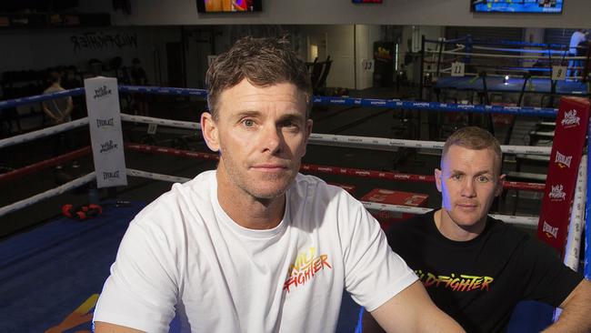 Boxing champion Will Tomlinson puts Cat legend Cam Mooney through his paces at Wildfighter gym before his boxing match with Tom Bellchambers. Picture: Alan Barber