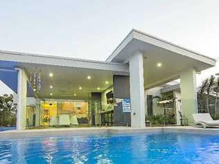 ELEGANT LIVING: The view from the in-ground pool into the house at Cormorant Cl that’s for sale for $1.99 million. Picture: Craig Chapman