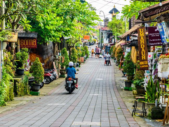 Tourists strolling along the central street of Ubud. Ubud is the cultural heart of Bali. It's full of restaurants, yoga studios, spaÃ¢â‚¬â„¢s and shops. This traditional country town is home to one of Bali's royal families.Escape 3 December 2023Why I travelPhoto - iStock