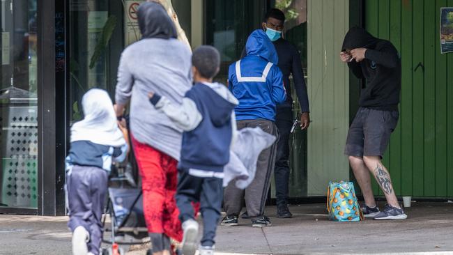 Children walk past intoxicated people. Richmond supervised injecting room on Lennox street.