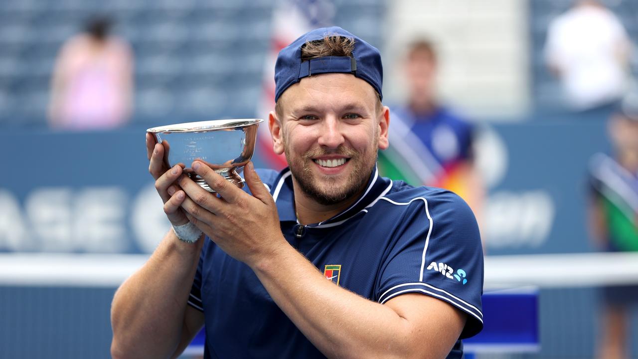 NEW YORK, NEW YORK - SEPTEMBER 12: Dylan Alcott of Australia celebrates with the championship trophy after defeating Niels Vink of the Netherlands to complete a 'Golden Slam' during their Wheelchair Quad Singles final match on Day Fourteen of the 2021 US Open at the USTA Billie Jean King National Tennis Center on September 12, 2021 in the Flushing neighborhood of the Queens borough of New York City. (Photo by Elsa/Getty Images)