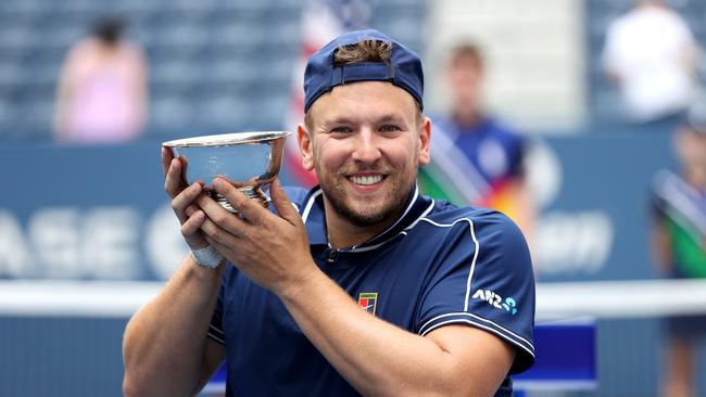 NEW YORK, NEW YORK - SEPTEMBER 12: Dylan Alcott of Australia celebrates with the championship trophy after defeating Niels Vink of the Netherlands to complete a 'Golden Slam' during their Wheelchair Quad Singles final match on Day Fourteen of the 2021 US Open at the USTA Billie Jean King National Tennis Center on September 12, 2021 in the Flushing neighborhood of the Queens borough of New York City. (Photo by Elsa/Getty Images)