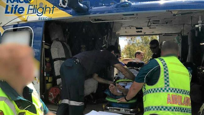 A man in his 20s is airlifted to hospital after his motorbike collided with a tree north of Biggenden. Picture: Courtesy RACQ LifeFlight Rescue