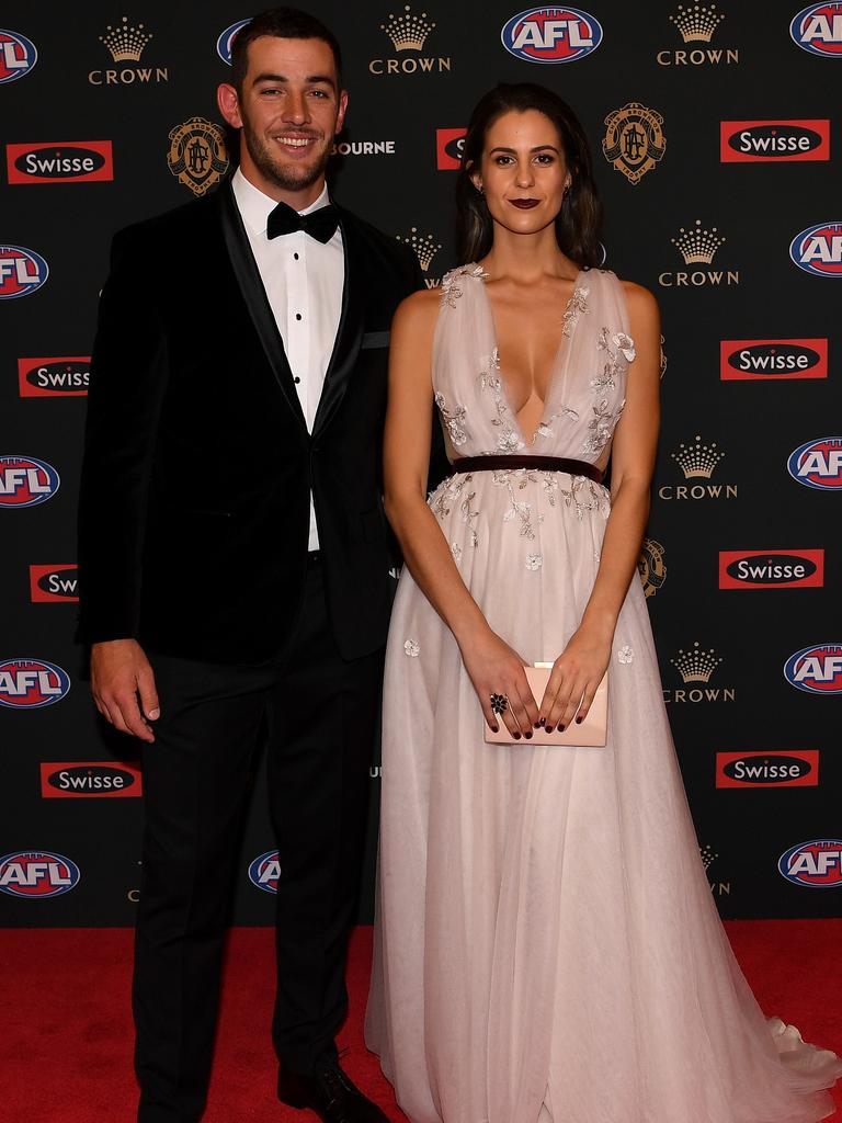 Taylor Walker of Adelaide and partner Ellie Brown. Picture: AAP