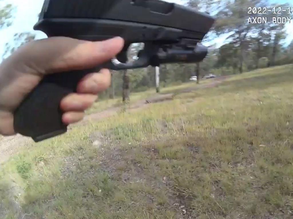 Still from Randall Kirk's body camera running from the Train's Wieambilla property while being shot at.