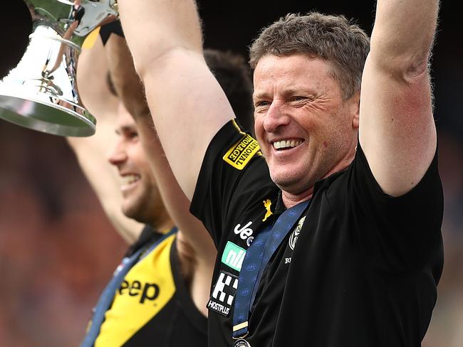 MELBOURNE, AUSTRALIA - SEPTEMBER 28: Tigers captain Trent Cotchin and Tigers head coach Damien Hardwick hold aloft the Premiership Trophy after victory in the 2019 AFL Grand Final match between the Richmond Tigers and the Greater Western Sydney Giants at Melbourne Cricket Ground on September 28, 2019 in Melbourne, Australia. (Photo by Mark Metcalfe/AFL Photos/via Getty Images )
